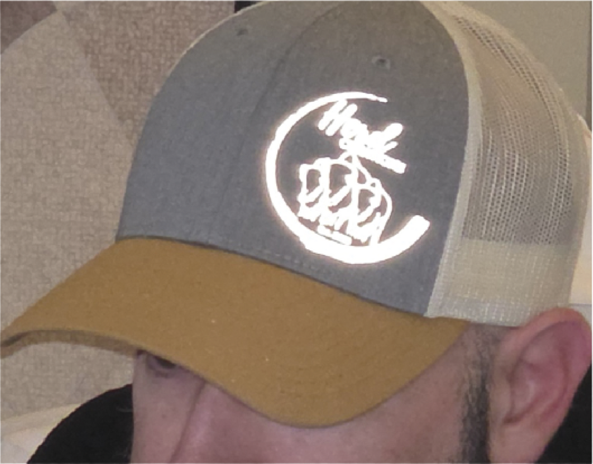 Reflective DTF transfer applied to a hat